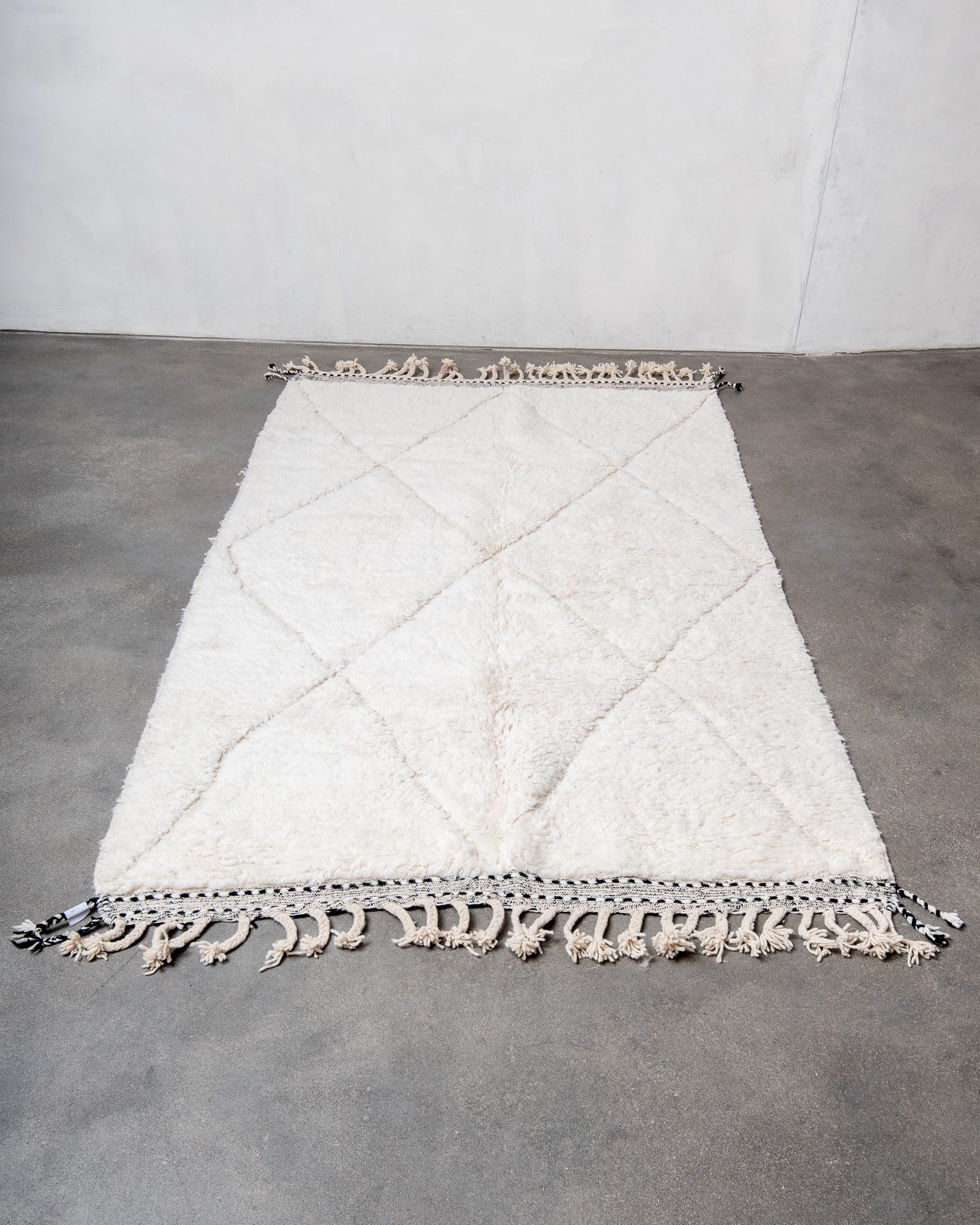 Modern, designer, handcrafted Berber rug from Morocco. Beniourain carpet with beautiful colours and patterns and fluffy wool texture.